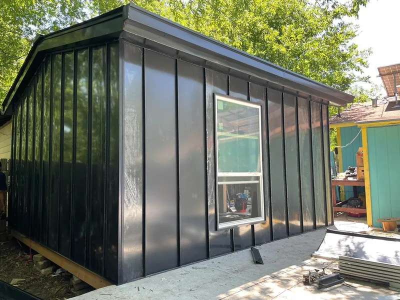 Black standing seam metal wall panels for Roof Inspection in Hugo